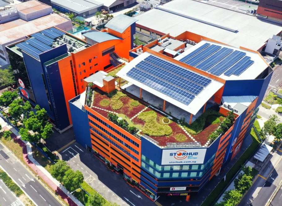 Photo of the StorHub building. In the picture you can see the terrace of the building, where there is a small garden and also solar panels.